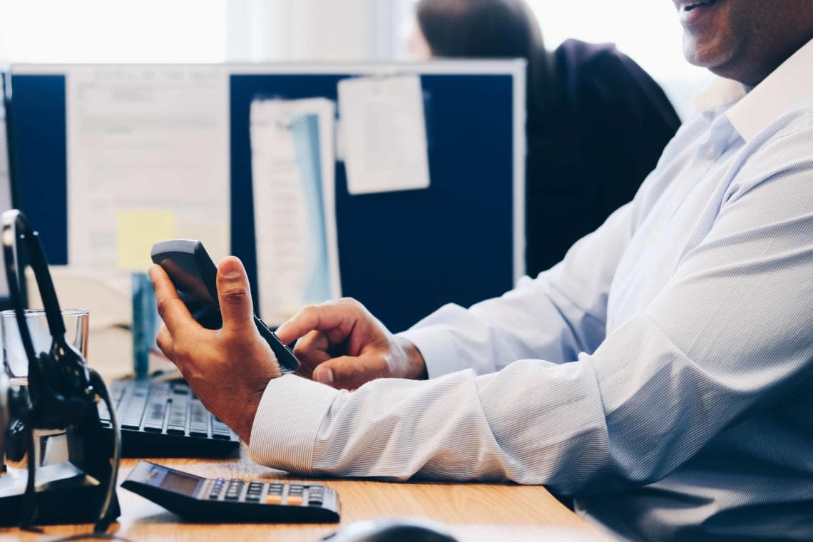 Accountant using calculator