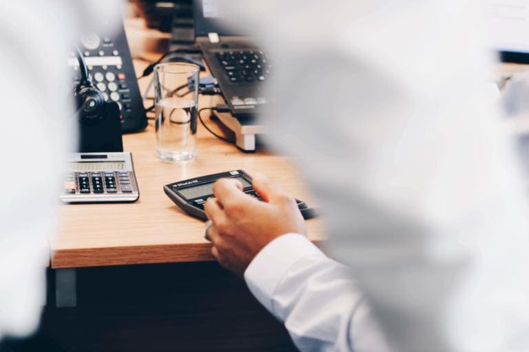 Accountant using a calculator