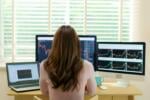 woman looking at forex trading graphs